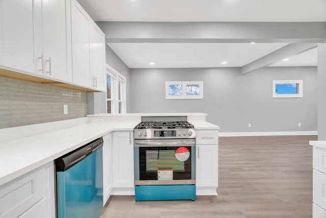 kitchen featuring tasteful backsplash, appliances with stainless steel finishes, light hardwood / wood-style flooring, and white cabinets