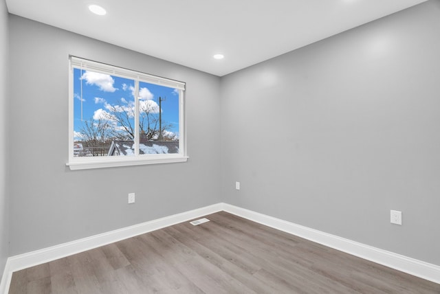 unfurnished room featuring wood-type flooring