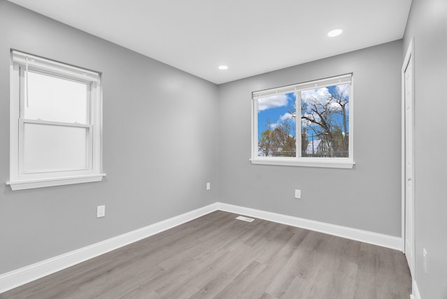 spare room featuring light wood-type flooring