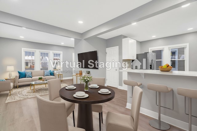 dining space featuring light wood-type flooring