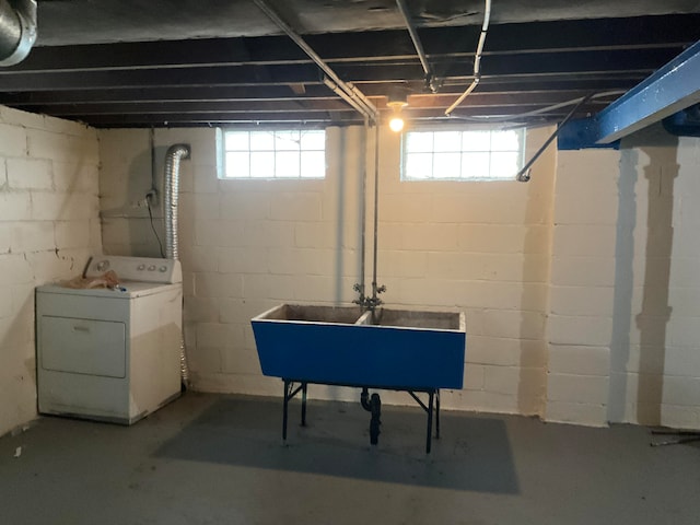 basement with sink and washer / dryer