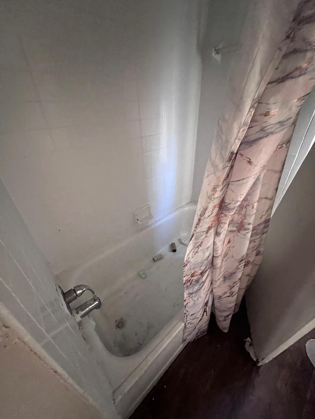 bathroom with shower / bath combination with curtain