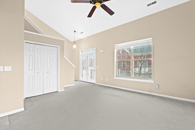 interior space featuring french doors, carpet floors, high vaulted ceiling, and ceiling fan