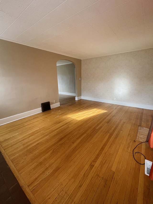 spare room with hardwood / wood-style flooring