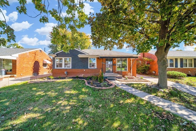 single story home featuring a front yard