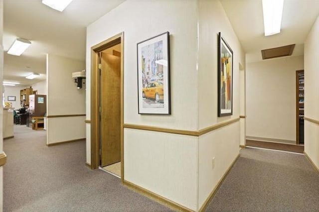 corridor with carpet flooring