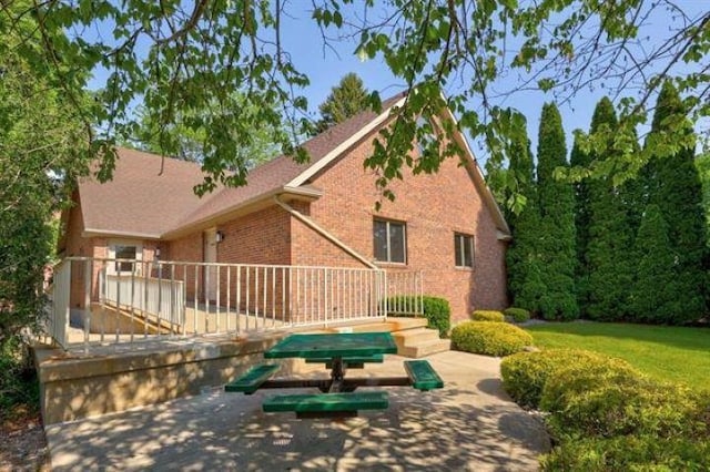 back of house with a patio area and a wooden deck