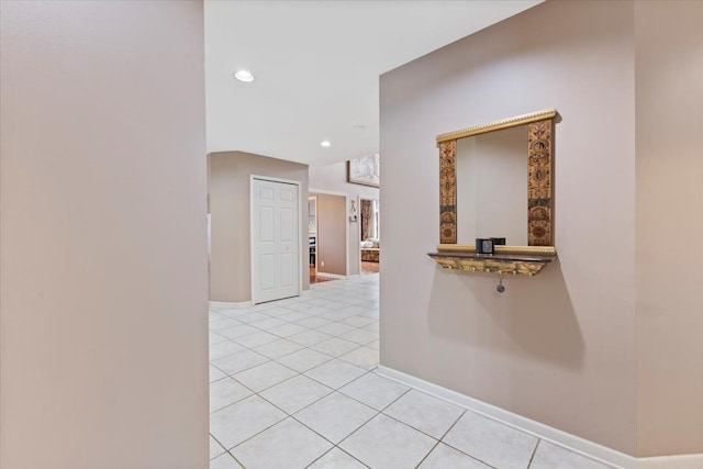 hall with light tile patterned floors