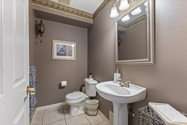 bathroom featuring tile patterned floors, sink, and toilet