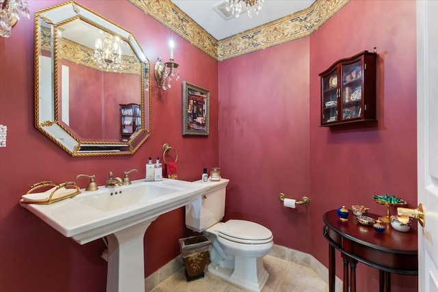 bathroom with tile patterned floors, toilet, and sink