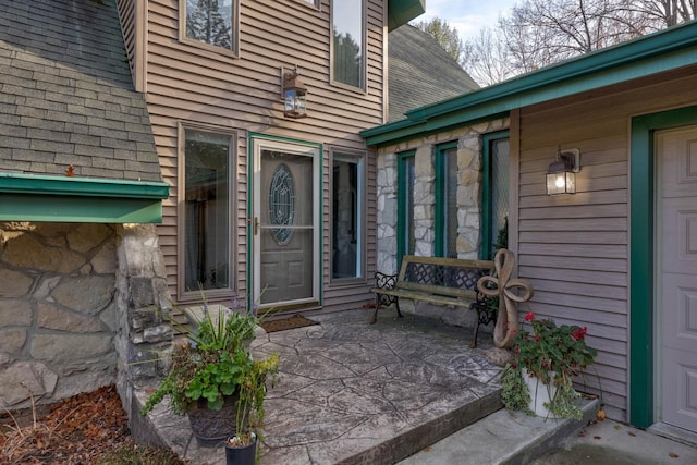 property entrance featuring a patio area