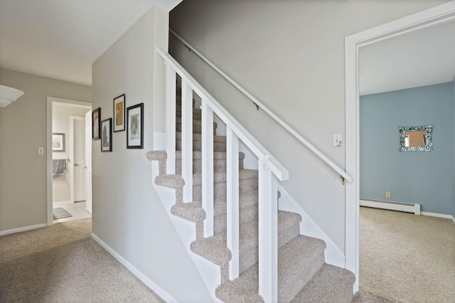 stairway featuring carpet and a baseboard radiator