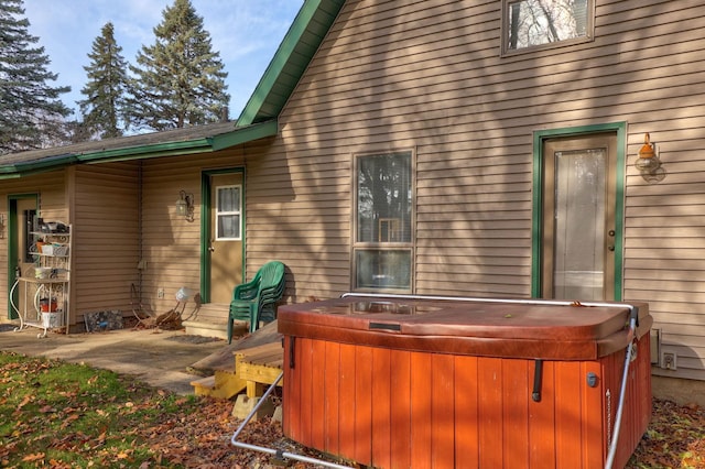 exterior space featuring a hot tub and a patio area