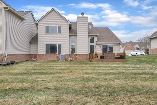 back of house with central AC, a yard, and a deck