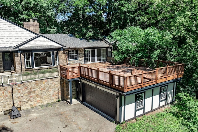 exterior space featuring a garage and a deck