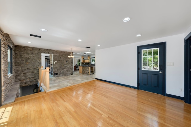 unfurnished living room with light hardwood / wood-style floors