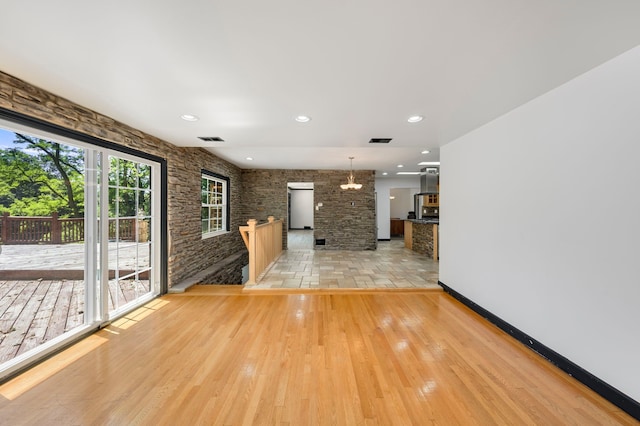 unfurnished living room featuring light hardwood / wood-style flooring