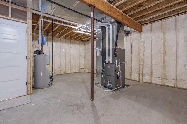 unfinished below grade area featuring gas water heater and heating unit