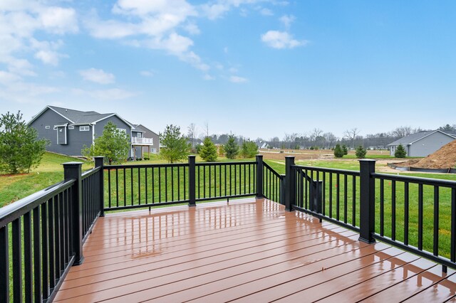 deck featuring a residential view and a yard