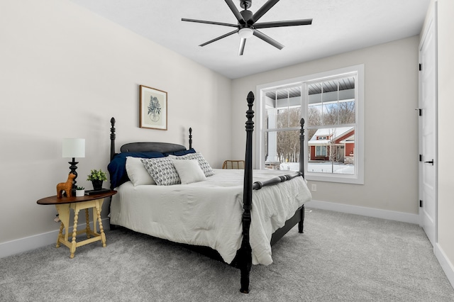 bedroom with ceiling fan, carpet, and baseboards