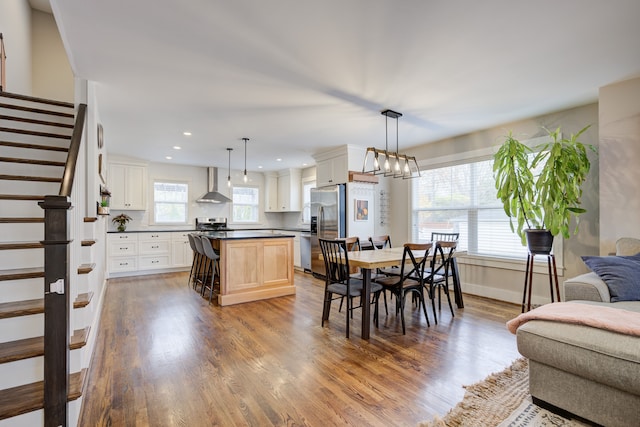 dining area featuring dark wood-type flooring