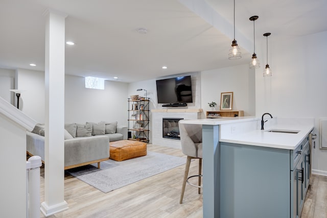 interior space with sink and light hardwood / wood-style floors