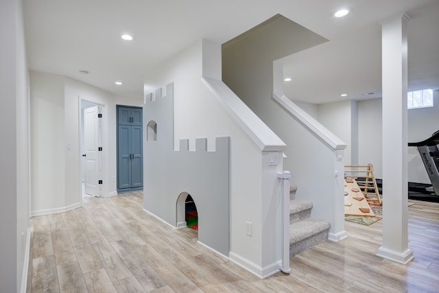 staircase with wood-type flooring