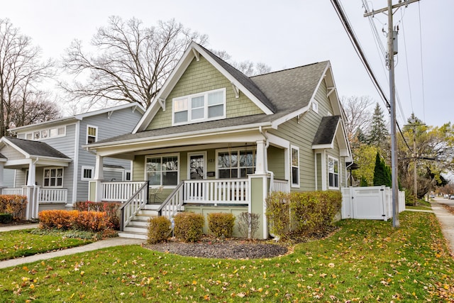 view of front of house featuring a porch and a front yard