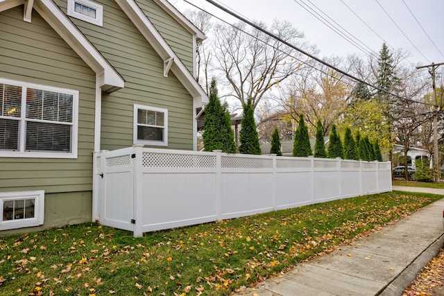 view of side of home with a lawn