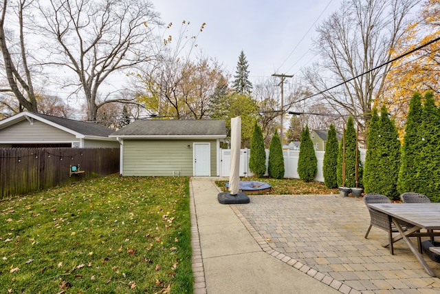 exterior space with a patio area and a yard