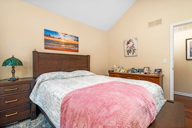 bedroom featuring dark hardwood / wood-style floors and lofted ceiling