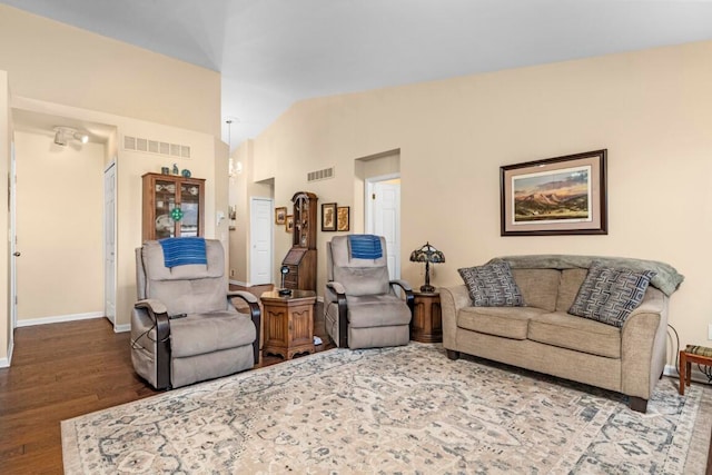 living room with wood-type flooring and vaulted ceiling