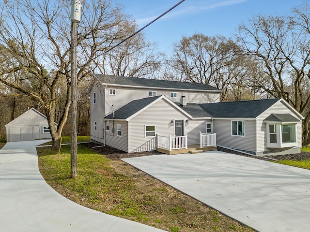 front of property featuring an outbuilding and a garage