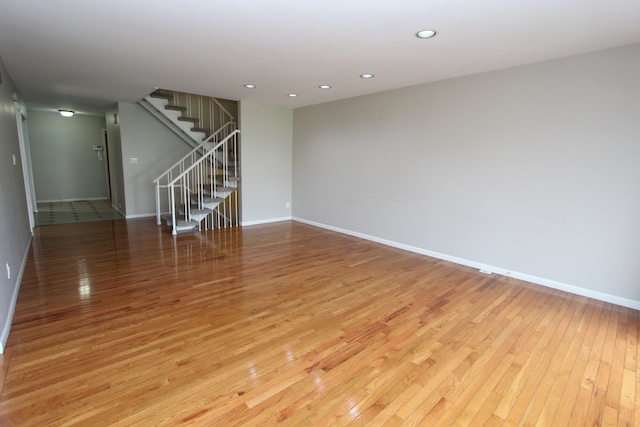 spare room featuring light hardwood / wood-style flooring