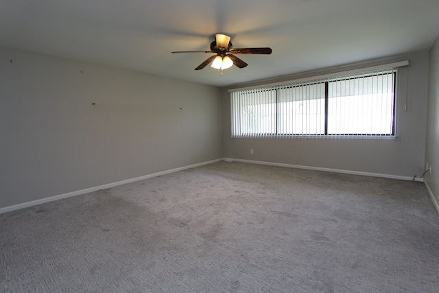 empty room with carpet and ceiling fan