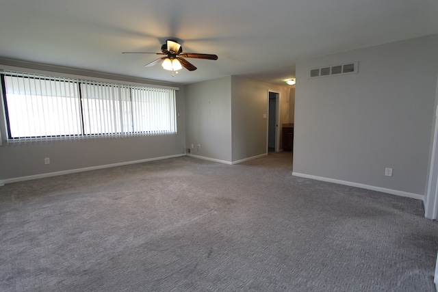 spare room with carpet flooring and ceiling fan