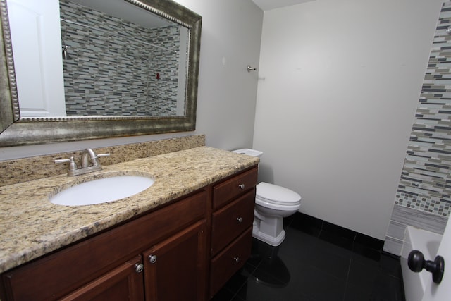 bathroom with tile patterned flooring, a bath, vanity, and toilet