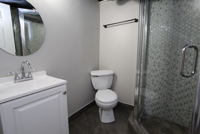 bathroom featuring tile patterned floors, vanity, toilet, and walk in shower