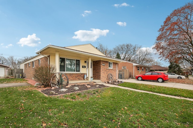 view of front of property with a porch, central air condition unit, and a front yard