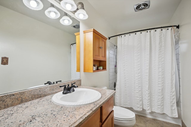 full bathroom featuring tile patterned floors, shower / tub combo with curtain, vanity, and toilet