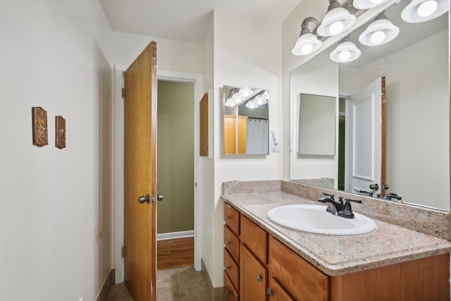 bathroom featuring tile patterned flooring and vanity