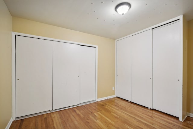 unfurnished bedroom with light hardwood / wood-style floors