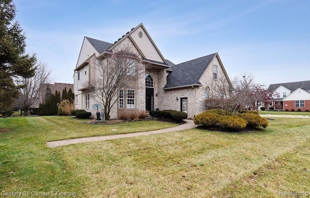 front facade with a front yard