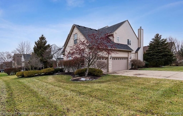 view of home's exterior featuring a yard and a garage