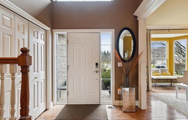 foyer entrance with hardwood / wood-style floors