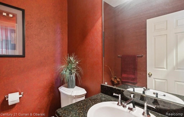 bathroom with vanity and toilet