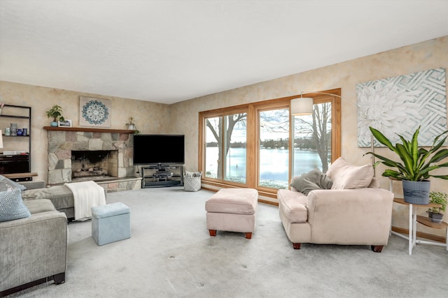 carpeted living room featuring a fireplace