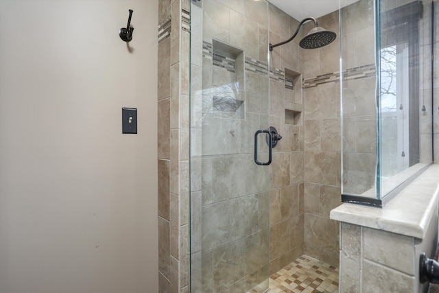 full bath featuring a shower stall