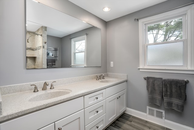 bathroom featuring hardwood / wood-style flooring and vanity