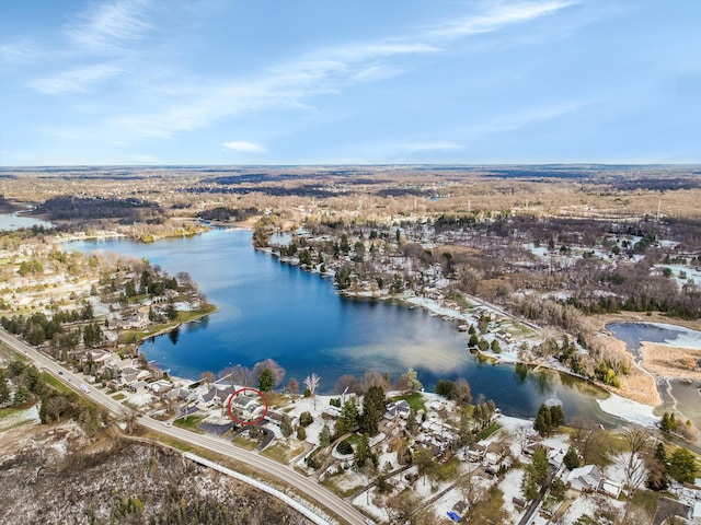 birds eye view of property with a residential view and a water view